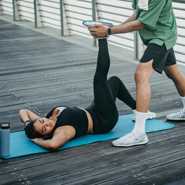 Person gently stretching on a mat, demonstrating improved flexibility and calm.
